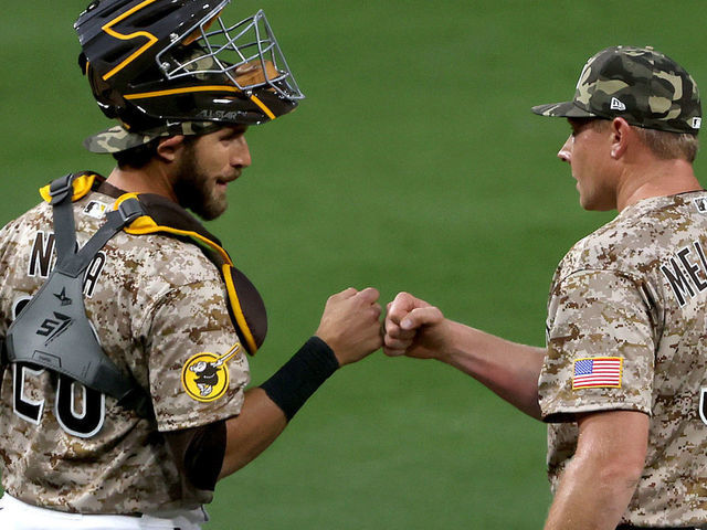 San Diego Padres shortstop Ha-Seong Kim, right, greets injured