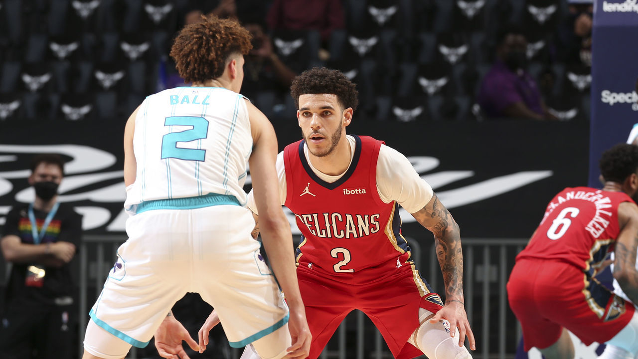 CHARLOTTE, NC - MAY 9: LaMelo Ball #2 of the Charlotte Hornets dribbles as Lonzo Ball #2 of the New Orleans Pelicans plays defense during the game on May 9, 2021 at Spectrum Center in Charlotte, North Carolina. Mandatory Copyright Notice: Copyright 2021 NBAE