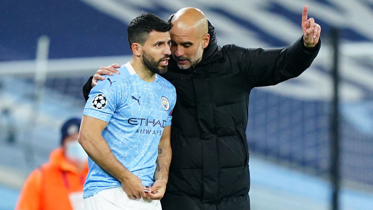 MANCHESTER, ENGLAND - MAY 04: Pep Guardiola, Manager of Manchester City talks with Sergio Aguero of Manchester City prior to being introduced into the game for Phil Foden of Manchester City (not pictured) during the UEFA Champions League Semi Final Second Leg match between Manchester City and Paris Saint-Germain at Etihad Stadium on May 04, 2021 in Manchester, England. Sporting stadiums around the UK remain under strict restrictions due to the Coronavirus Pandemic as Government social distancing laws prohibit fans inside venues resulting in games being played behind closed doors.