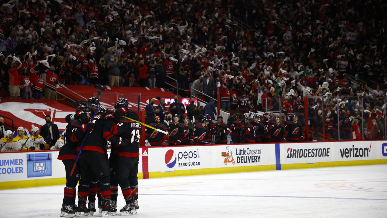 RALEIGH, NORTH CAROLINA - MAY 17: The Carolina Hurricanes celebrate following a goal by Jordan Staal #11 of the Carolina Hurricanes against the Nashville Predators during the third period in Game One of the First Round of the 2021 Stanley Cup Playoffs at PNC Arena on May 17, 2021 in Raleigh, North Carolina.