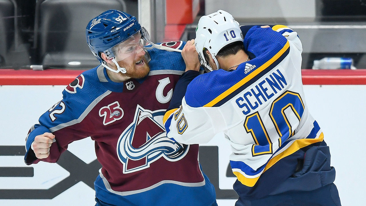 DENVER, CO - MAY 17: Colorado Avalanche left wing Gabriel Landeskog (92) and St. Louis Blues center Brayden Schenn (10) fight on the ice in the first period during a Stanley Cup Playoffs first round game between the St. Louis Blues and the Colorado Avalanche at Ball Arena in Denver, Colorado on May 17, 2021.