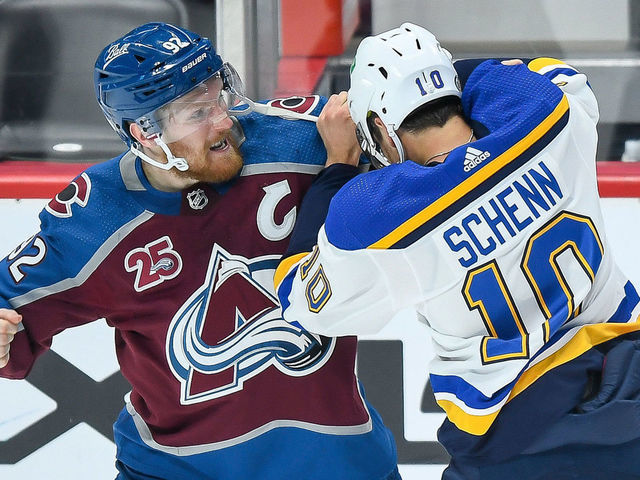 DENVER, CO - MAY 17: Colorado Avalanche left wing Gabriel Landeskog (92) and St. Louis Blues center Brayden Schenn (10) fight on the ice in the first period during a Stanley Cup Playoffs first round game between the St. Louis Blues and the Colorado Avalanche at Ball Arena in Denver, Colorado on May 17, 2021.
