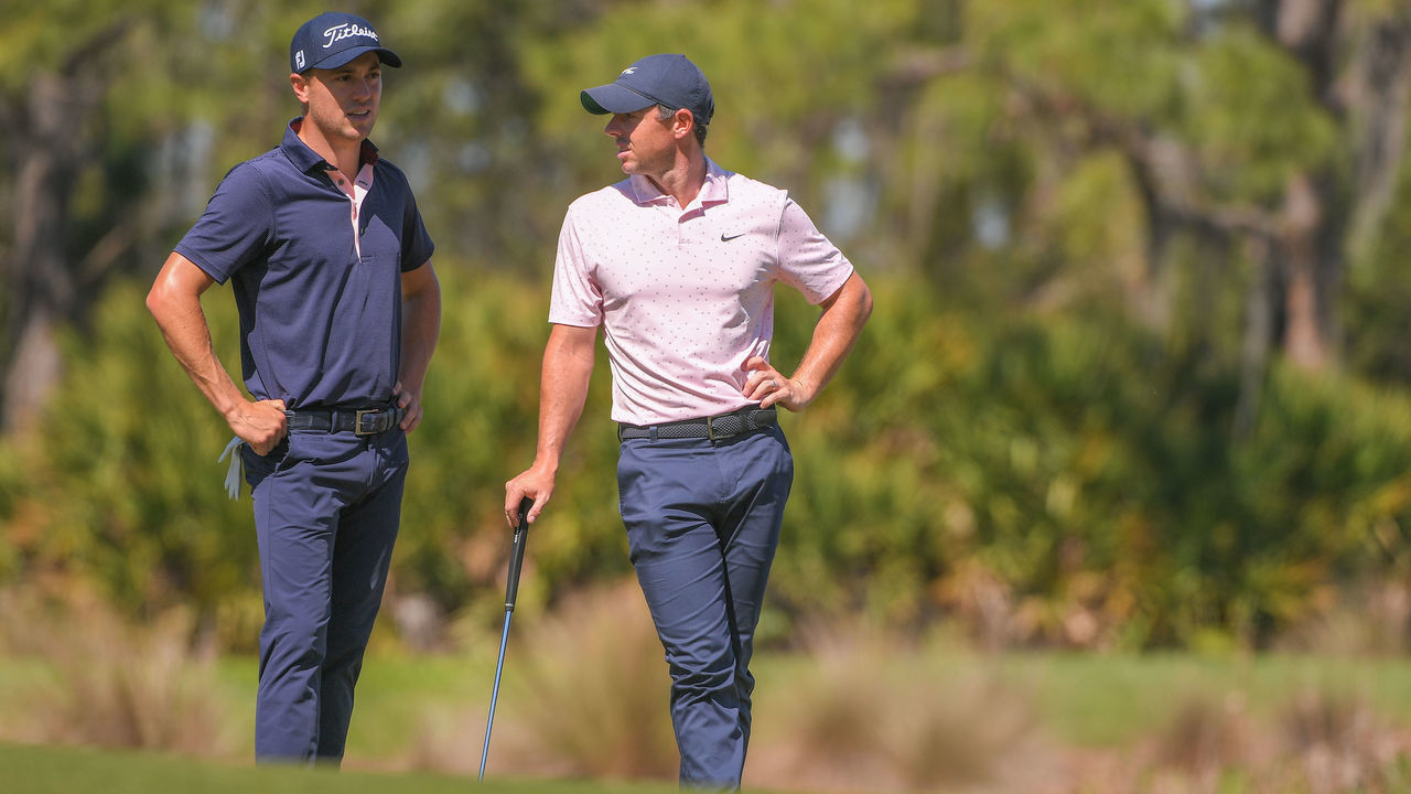 BRADENTON, FLORIDA - FEBRUARY 25: Justin Thomas and Rory McIlroy of Northern Ireland stand together on the 11th green during the first round of the World Golf Championships-Workday Championship at The Concession on February 25, 2021 in Bradenton, Florida.