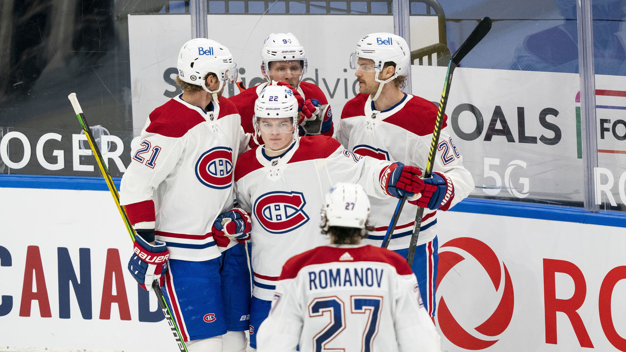 TORONTO, ON - MAY 6: Cole Caufield #22 of the Montreal Canadiens celebrates his goal against the Toronto Maple Leafs with teammates Eric Staal #21, Corey Perry #94, Jon Merrill #28 and Alexander Romanov #27 during the second period at the Scotiabank Arena on May 6, 2021 in Toronto, Ontario, Canada.