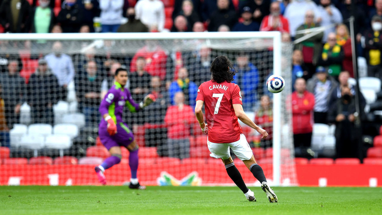 Manchester United's Edinson Cavani scores their side's first goal of the game during the Premier League match at Old Trafford, Manchester. Picture date: Tuesday May 18, 2021.