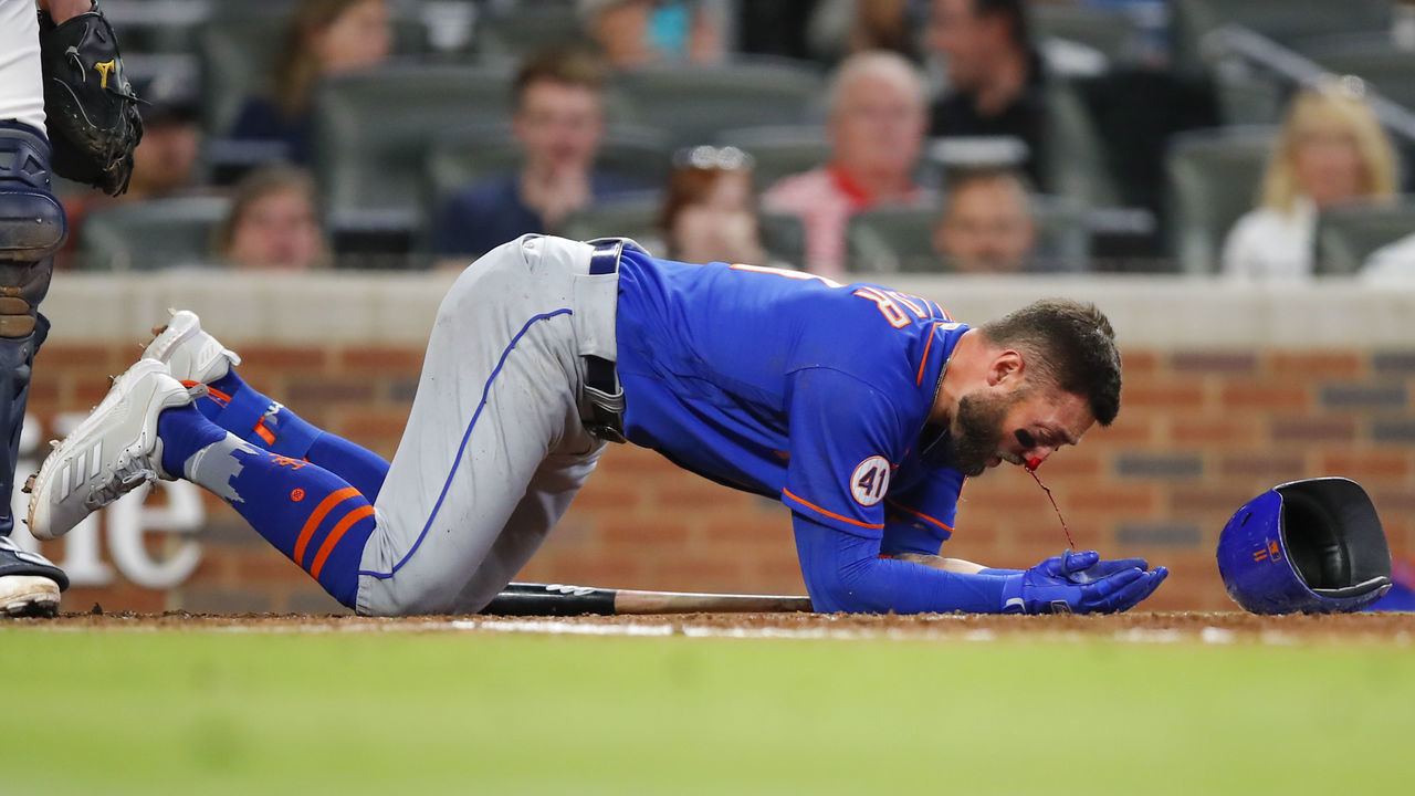 ATLANTA, GA - MAY 17: Kevin Pillar #11 of the New York Mets takes a moment as his nose bleeds after being hit by a pitch in the seventh inning of an MLB game against the Atlanta Braves at Truist Park on May 17, 2021 in Atlanta, Georgia.