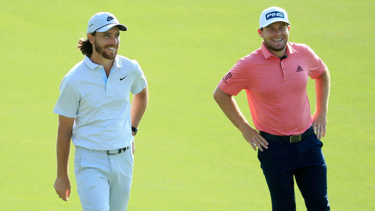DUBAI, UNITED ARAB EMIRATES - DECEMBER 11: Tyrrell Hatton of England speaks with Tommy Fleetwood of England before they play their second shots on the 12th hole during Day Two of the DP World Tour Championship at Jumeirah Golf Estates on December 11, 2020 in Dubai, United Arab Emirates.