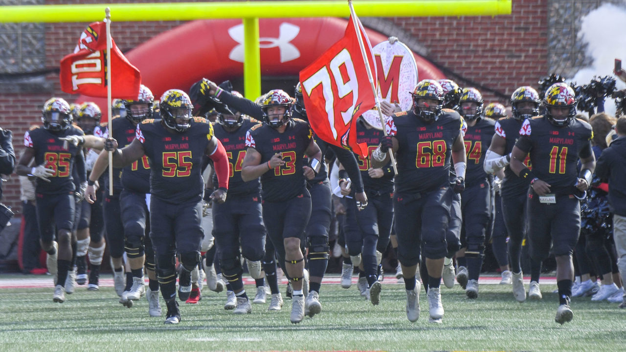 COLLEGE PARK, MD - NOVEMBER 3: Maryland offensive lineman Ellis McKennie (68) carries the #79 flag on the field to honor Jordan McNair prior to action against Michigan State at Maryland Stadium.