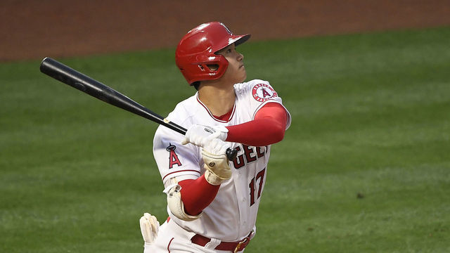 ANAHEIM, CA - MAY 17: Shohei Ohtani #17 of the Los Angeles Angels hits a three-run home run against pitcher Sam Hentges of the Cleveland Indians as catcher Rene Rivera #46 looks on during the second inning at Angel Stadium of Anaheim on May 17, 2021 in Anaheim, California.