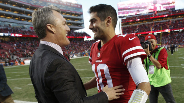 SANTA CLARA, CA - DECEMBER 17: General Manager John Lynch and Jimmy Garoppolo #10 of the San Francisco 49ers celebrate on the field following the game against the Tennessee Titans at Levi's Stadium on December 17, 2017 in Santa Clara, California. The 49ers defeated the Titans 25-23.