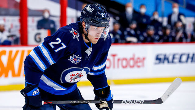 WINNIPEG, MB - APRIL 22: Nikolaj Ehlers #27 of the Winnipeg Jets prepares for a first period face-off against the Toronto Maple Leafs at Bell MTS Place on April 22, 2021 in Winnipeg, Manitoba.