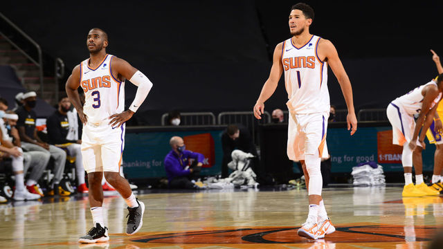 PHOENIX, AZ - DECEMBER 16: Chris Paul #3 and Devin Booker #1 of Phoenix Suns looks on against the Los Angeles Lakers on December 16, 2020 at the Talking Stick Resort Arena in Phoenix, Arizona. Mandatory Copyright Notice: Copyright 2020 NBAE