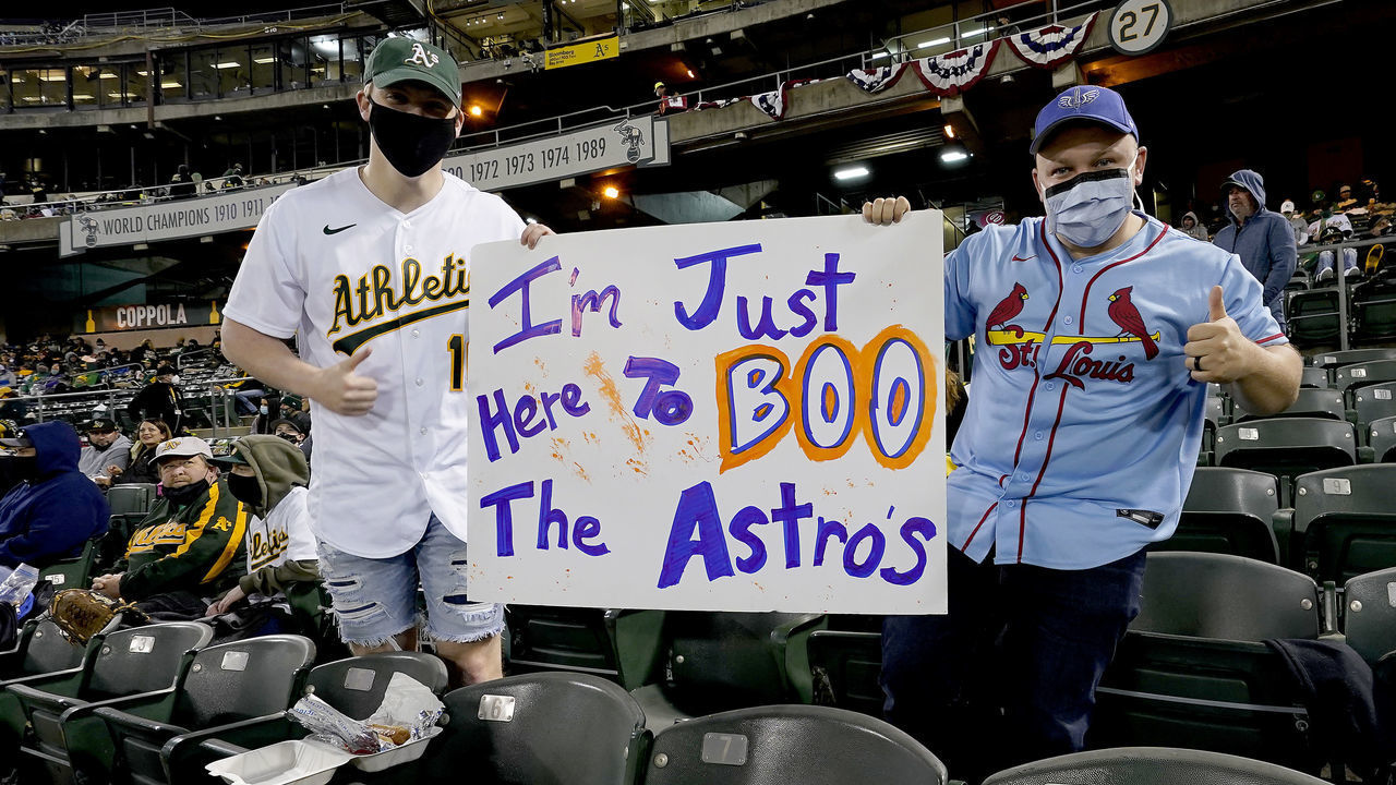OAKLAND, CALIFORNIA - APRIL 02: Fans showing off their sign to "Boo" the Houston Astros playing the Oakland Athletics at RingCentral Coliseum on April 02, 2021 in Oakland, California.