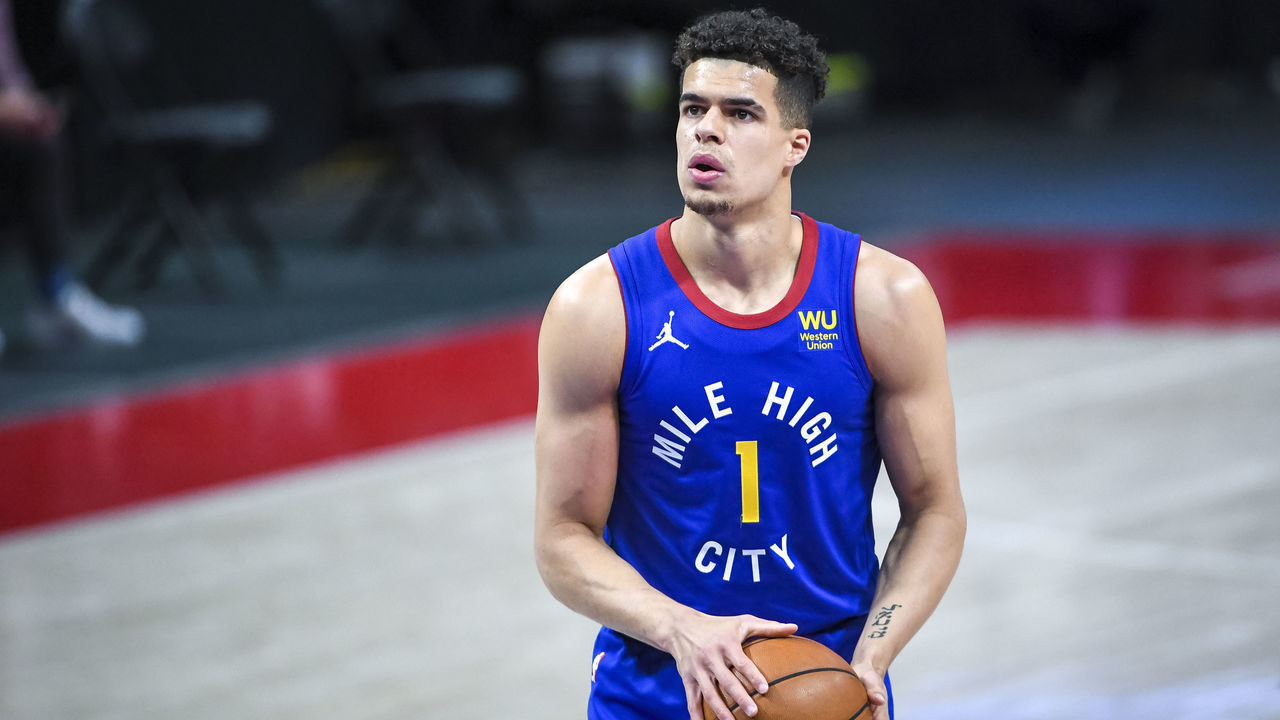 DETROIT, MICHIGAN - MAY 14: Michael Porter Jr. #1 of the Denver Nuggets shoots a free throw against the Detroit Pistons during the first quarter of the NBA game at Little Caesars Arena on May 14, 2021 in Detroit, Michigan.