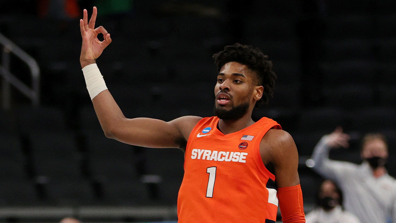 INDIANAPOLIS, INDIANA - MARCH 21: Quincy Guerrier #1 of the Syracuse Orange reacts after a three point basket against the West Virginia Mountaineers in the first half of their second round game of the 2021 NCAA Men's Basketball Tournament at Bankers Life Fieldhouse on March 21, 2021 in Indianapolis, Indiana.