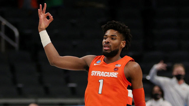 INDIANAPOLIS, INDIANA - MARCH 21: Quincy Guerrier #1 of the Syracuse Orange reacts after a three point basket against the West Virginia Mountaineers in the first half of their second round game of the 2021 NCAA Men's Basketball Tournament at Bankers Life Fieldhouse on March 21, 2021 in Indianapolis, Indiana.