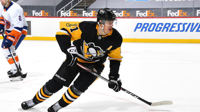 PITTSBURGH, PA - FEBRUARY 18: Evgeni Malkin #71 of the Pittsburgh Penguins skates against the New York Islanders at PPG PAINTS Arena on February 18, 2021 in Pittsburgh, Pennsylvania.