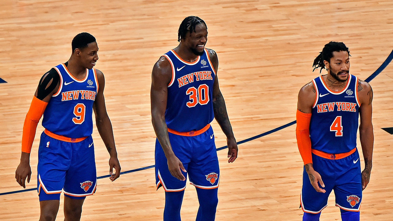 MEMPHIS, TENNESSEE - MAY 03: RJ Barrett #9, Julius Randle #30 and Derrick Rose #4 of the New York Knicks walk on the court during the second half against the Memphis Grizzlies at FedExForum on May 03, 2021 in Memphis, Tennessee.