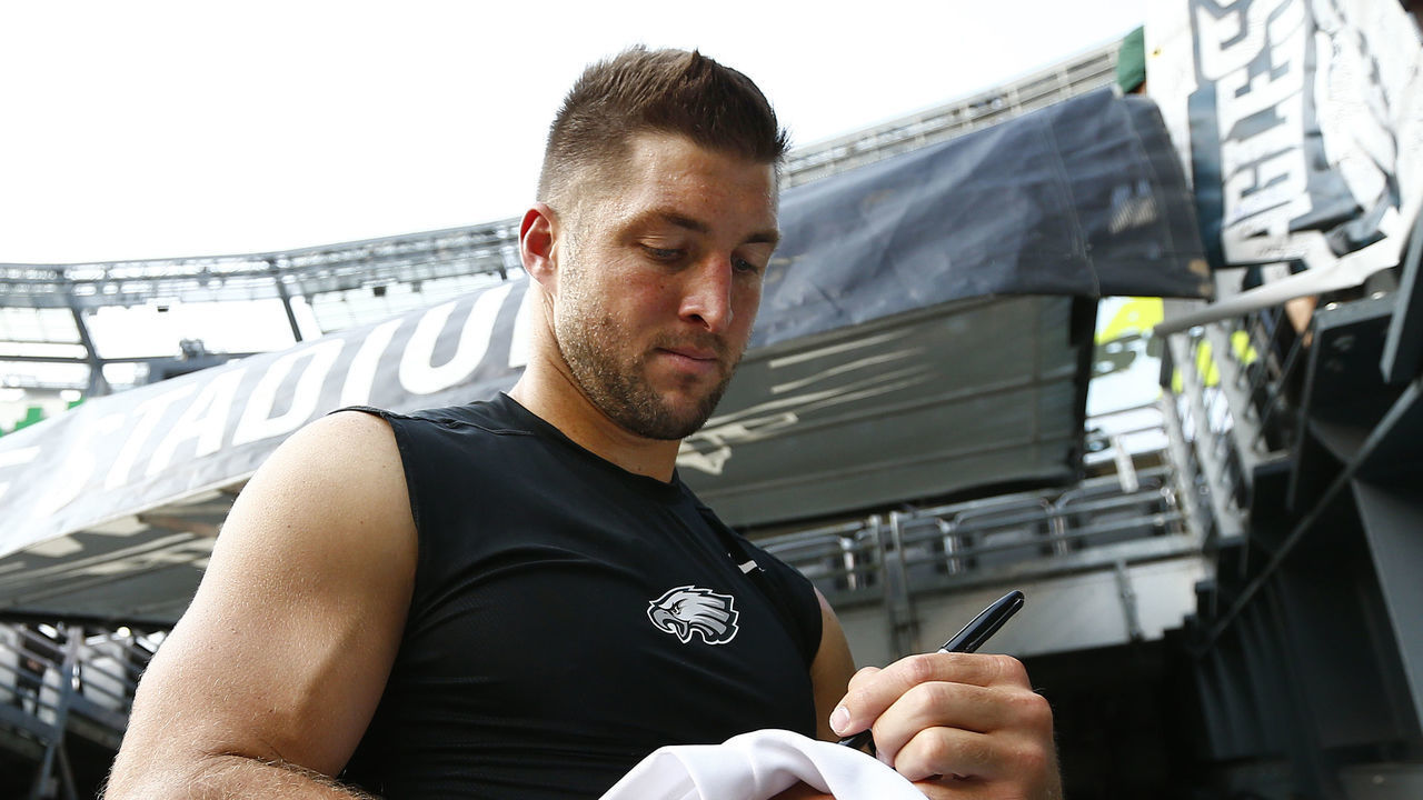 EAST RUTHERFORD, NJ - SEPTEMBER 03: Tim Tebow #11of the Philadelphia Eagles signs autographs before a pre-season game against the New York Jets at MetLife Stadium on September 3, 2015 in East Rutherford, New Jersey.
