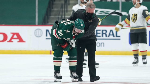 ST. PAUL, MN - MAY 20: Marcus Johansson #90 of the Minnesota Wild is helped off the ice by medical staff after colliding with the net against the Vegas Golden Knights in the first period in game three of the first round of the 2021 Stanley Cup Playoffs at Xcel Energy Center on May 20, 2021 in St Paul, Minnesota.