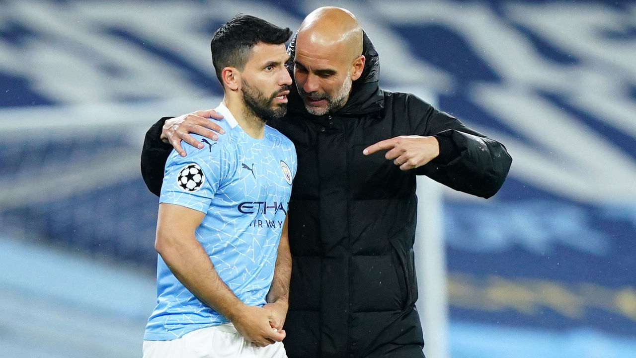 MANCHESTER, ENGLAND - MAY 04: Pep Guardiola, Manager of Manchester City talks with Sergio Aguero of Manchester City prior to being introduced into the game for Phil Foden of Manchester City (not pictured) during the UEFA Champions League Semi Final Second Leg match between Manchester City and Paris Saint-Germain at Etihad Stadium on May 04, 2021 in Manchester, England. Sporting stadiums around the UK remain under strict restrictions due to the Coronavirus Pandemic as Government social distancing laws prohibit fans inside venues resulting in games being played behind closed doors.