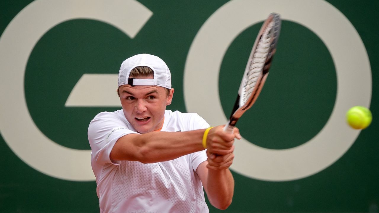 Switzerland's Dominic Stricker returns a ball during his ATP 250 Geneva Open tennis match against Croatia's Marin Cilic in Geneva on May 18, 2021.