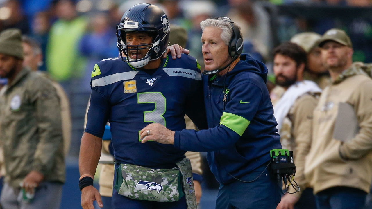 SEATTLE, WA - NOVEMBER 03: Head coach Pete Carroll of the Seattle Seahawks talks with quarterback Russell Wilson #3 against the Tampa Bay Buccaneers at CenturyLink Field on November 3, 2019 in Seattle, Washington.