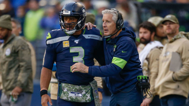 SEATTLE, WA - NOVEMBER 03: Head coach Pete Carroll of the Seattle Seahawks talks with quarterback Russell Wilson #3 against the Tampa Bay Buccaneers at CenturyLink Field on November 3, 2019 in Seattle, Washington.