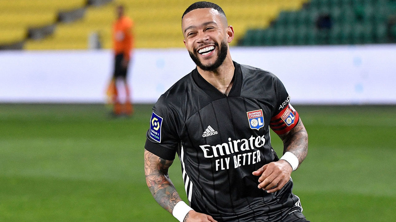Lyon's Dutch forward Memphis Depay celebrates after scoring a penalty kick during the French L1 football match between FC Nantes and Olympique Lyonnais at the La Beaujoire Stadium in Nantes, western France, on April 18, 2021.
