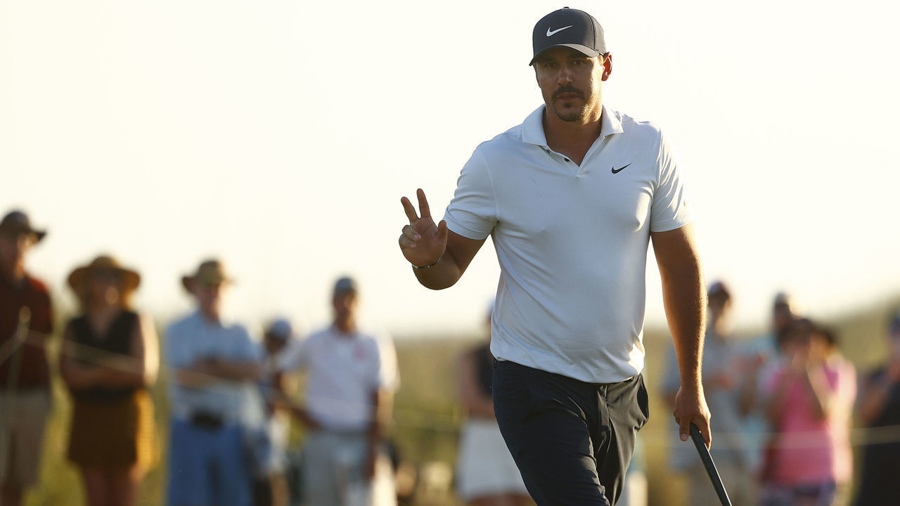 KIAWAH ISLAND, SOUTH CAROLINA - MAY 21: Brooks Koepka of the United States waves on the 18th green during the second round of the 2021 PGA Championship at Kiawah Island Resort's Ocean Course on May 21, 2021 in Kiawah Island, South Carolina.