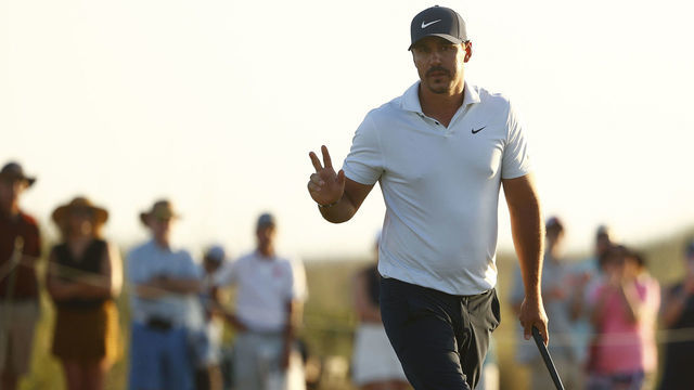 KIAWAH ISLAND, SOUTH CAROLINA - MAY 21: Brooks Koepka of the United States waves on the 18th green during the second round of the 2021 PGA Championship at Kiawah Island Resort's Ocean Course on May 21, 2021 in Kiawah Island, South Carolina.