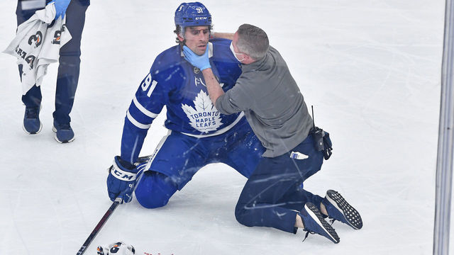 TORONTO, ON - MAY 20: Toronto Maple Leafs staff attend ro Toronto Maple Leafs Center John Tavares (91) after he was injured during game one of the NHL Stanley Cup Playoffs First Round between the Montreal Canadiens and Toronto Maple Leafs on May 20, 2021 at Scotiabank Arena in Toronto, ON.