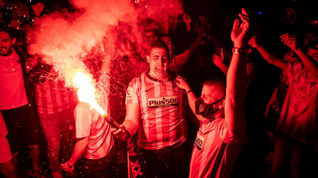 MADRID, SPAIN - 2021/05/22: Atletico de Madrid fans celebrating with a flare the Spanish League Championship title in Neptuno Square. Atletico de Madrid won the title in the last match of the season with a 2-1 victory over Valladolid.