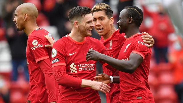 Liverpool's Sadio Mane (right) celebrates with Andrew Robertson after scoring their side's second goal of the game during the Premier League match at Anfield, Liverpool. Picture date: Sunday May 23, 2021.