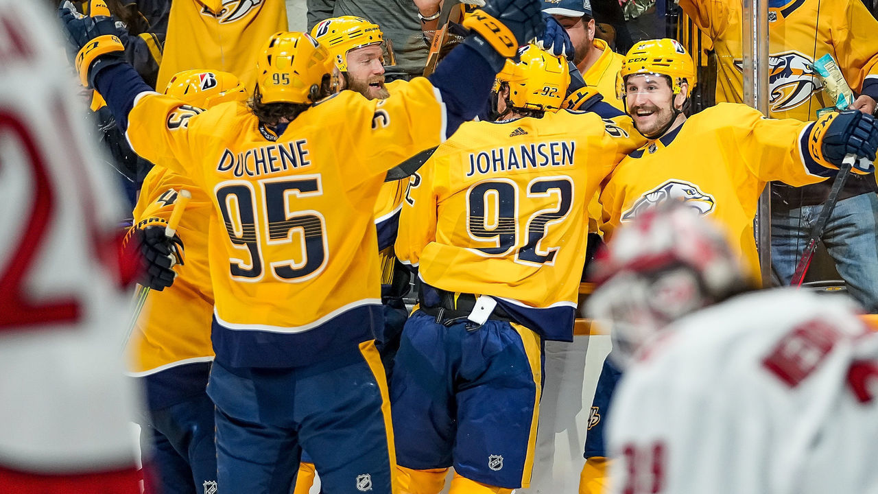 NASHVILLE, TN - MAY 23: Ryan Johansen #92 celebrates his goal with Filip Forsberg #9 and Matt Duchene #95 of the Nashville Predators against the Carolina Hurricanes in Game Four of the First Round of the 2021 Stanley Cup Playoffs at Bridgestone Arena on May 23, 2021 in Nashville, Tennessee.
