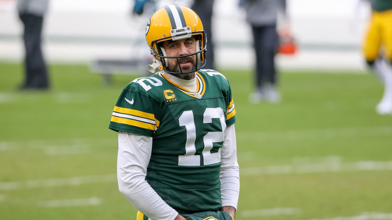 GREEN BAY, WISCONSIN - JANUARY 24: Aaron Rodgers #12 of the Green Bay Packers warms up before the NFC Championship game against the Tampa Bay Buccaneers at Lambeau Field on January 24, 2021 in Green Bay, Wisconsin.