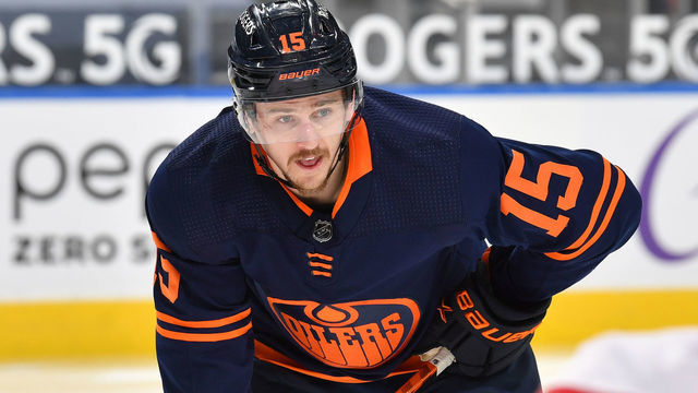 EDMONTON, AB - APRIL 19: Josh Archibald #15 of the Edmonton Oilers awaits a face-off during the game against the Montreal Canadiens on April 19, 2021 at Rogers Place in Edmonton, Alberta, Canada.
