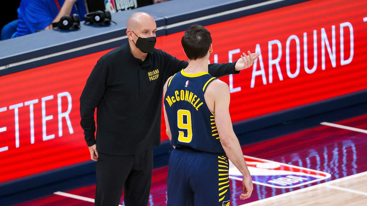 INDIANAPOLIS, INDIANA - APRIL 19: Head coach Nate Bjorkgren of the Indiana Pacers meets with T.J. McConnell #9 in the first quarter against the San Antonio Spurs at Bankers Life Fieldhouse on April 19, 2021 in Indianapolis, Indiana.