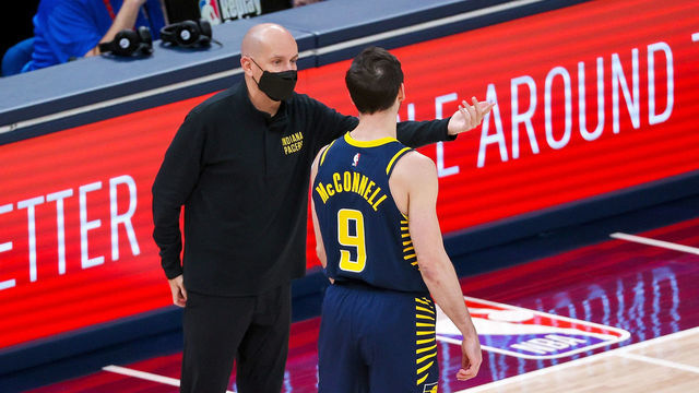 INDIANAPOLIS, INDIANA - APRIL 19: Head coach Nate Bjorkgren of the Indiana Pacers meets with T.J. McConnell #9 in the first quarter against the San Antonio Spurs at Bankers Life Fieldhouse on April 19, 2021 in Indianapolis, Indiana.