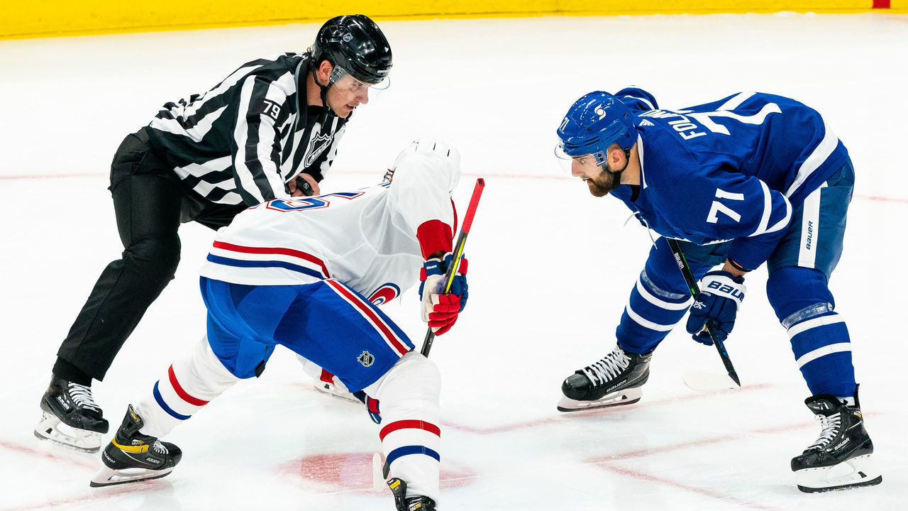 TORONTO, ON - MAY 22: Nick Foligno #71 of the Toronto Maple Leafs takes a face off against Jesperi Kotkaniemi #15 of the Montreal Canadiens during the third period in Game Two of the First Round of the 2021 Stanley Cup Playoffs at the Scotiabank Arena on May 22, 2021 in Toronto, Ontario, Canada.