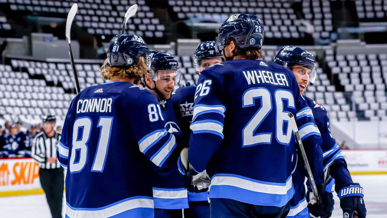 Wheeler helps Jets beat Canucks, clinch 3rd place in North - The