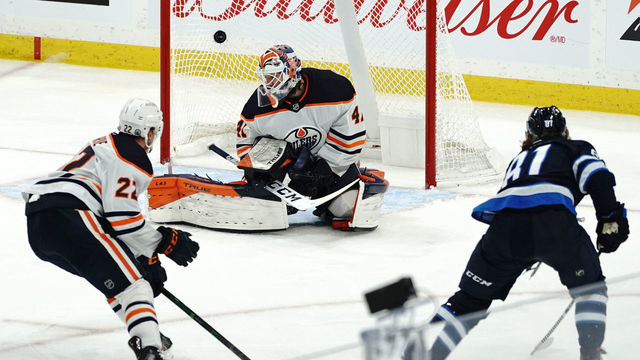 WINNIPEG, MB - MAY 24: Kyle Connor #81 of the Winnipeg Jets scores the game-winning goal against Mike Smith #41 of the Edmonton Oilers during the overtime period in Game Four of the First Round of the 2021 Stanley Cup Playoffs on May 24, 2021 at Bell MTS Place in Winnipeg, Manitoba, Canada.