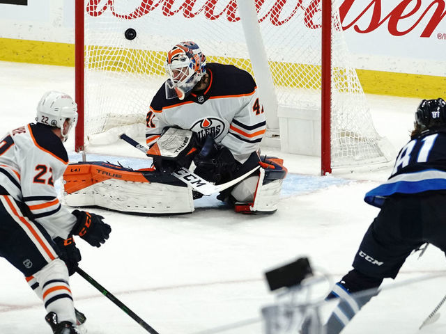 WINNIPEG, MB - MAY 24: Kyle Connor #81 of the Winnipeg Jets scores the game-winning goal against Mike Smith #41 of the Edmonton Oilers during the overtime period in Game Four of the First Round of the 2021 Stanley Cup Playoffs on May 24, 2021 at Bell MTS Place in Winnipeg, Manitoba, Canada.