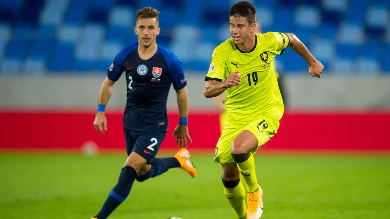 Slovakia's defender Peter Pekarik and Czech Republic's Adam Hlozek vie for the ball during the UEFA Nations League football match between Slovakia and Czech Republic in Bratislava, Slovakia, on September 4, 2020.