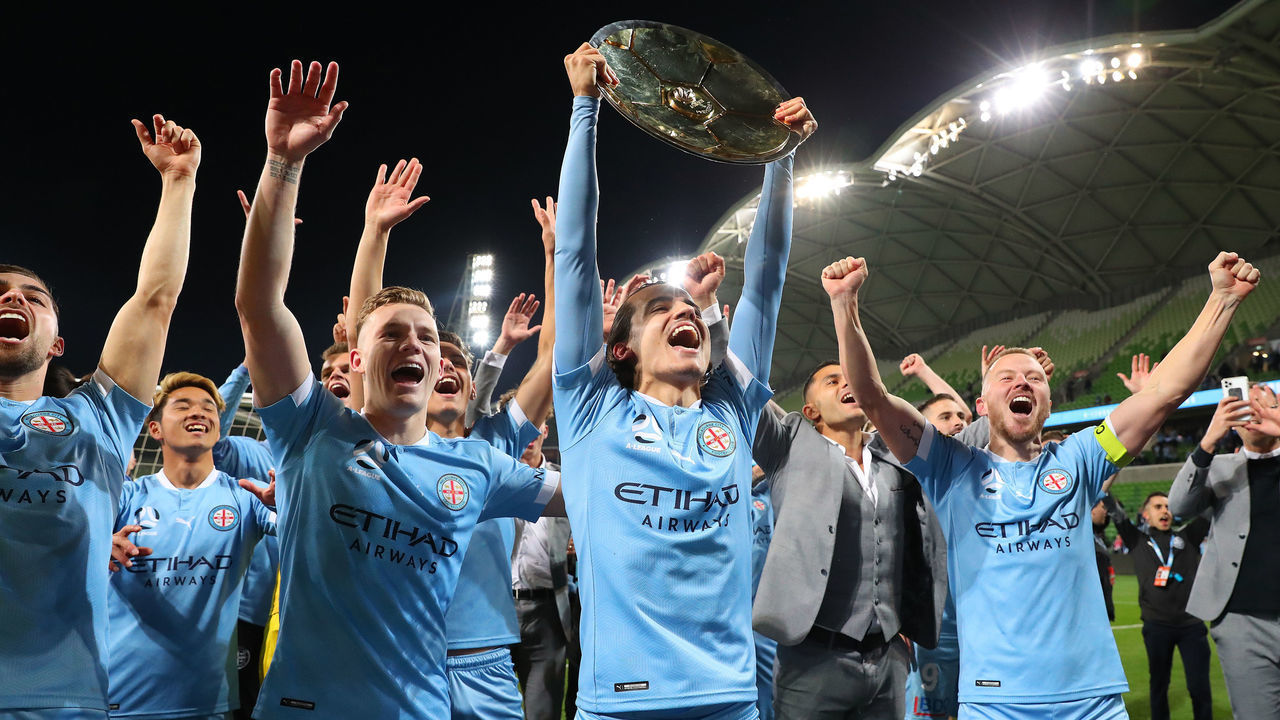 MELBOURNE, AUSTRALIA - MAY 22: Scott Galloway, Stefan Colakovski, Scott Jamieson (c) of Melbourne City and team mates celebrate winning the A-League Premiers Plate during the A-League match between Melbourne City and Central Coast Mariners at AAMI Park, on May 22, 2021, in Melbourne, Australia.