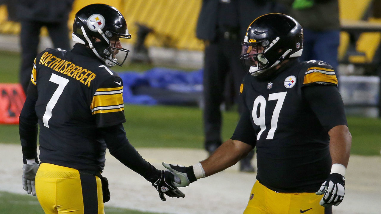 PITTSBURGH, PENNSYLVANIA - DECEMBER 07: Ben Roethlisberger #7 of the Pittsburgh Steelers celebrates with teammate Cameron Heyward #97 following a touchdown pass during the second quarter of their game against the Washington Football Team at Heinz Field on December 07, 2020 in Pittsburgh, Pennsylvania.