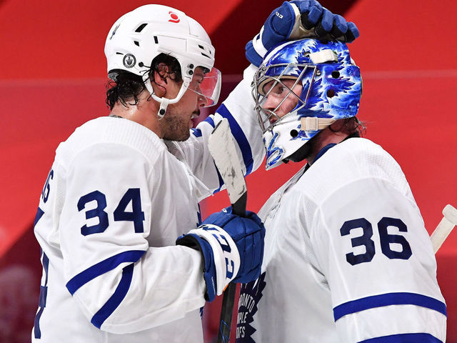 MONTREAL, QC - MAY 24: Auston Matthews #34 of the Toronto Maple Leafs celebrates with goalie Jack Campbell #36 after defeating the Montreal Canadiens in Game Three of the First Round of the 2021 Stanley Cup Playoffs at the Bell Centre on May 24, 2021 in Montreal, Quebec, Canada.