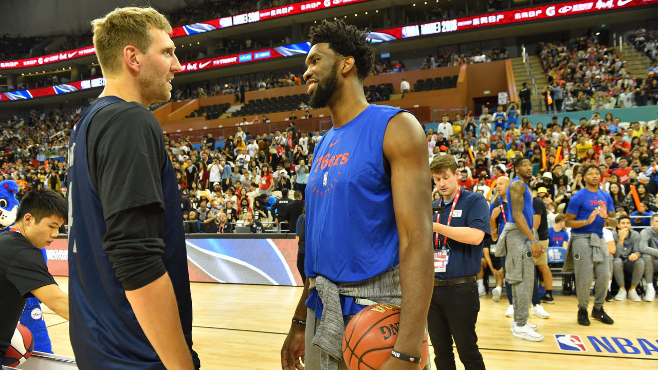 SHANGHAI, CHINA - OCTOBER 4: Dirk Nowitzki of the Dallas Mavericks and Joel Embiid of the Philadelphia 76ers during 2018 Fan Day as part of the 2018 China Games on October 4, 2018 at the Oriental Sports Center in Shanghai, China. NOTE TO USER: User expressly acknowledges and agrees that, by downloading and/or using this photograph, user is consenting to the terms and conditions of the Getty Images License Agreement. Mandatory Copyright Notice: Copyright 2018 NBAE