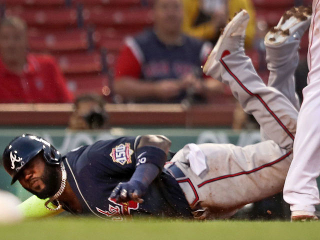 Marcell Ozuna injured sliding into third base