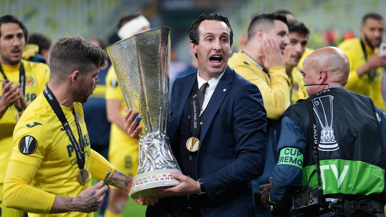 Villarreal's Spanish coach Unai Emery poses for pictures with the trophy after winning the UEFA Europa League final football match between Villarreal CF and Manchester United at the Gdansk Stadium in Gdansk on May 26, 2021.